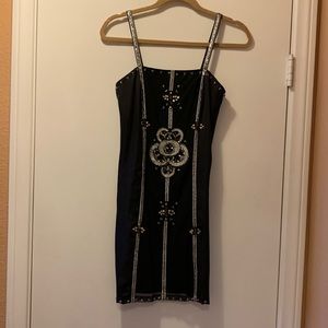 Brand new beaded cocktail dress with silver sequinned spaghetti straps.